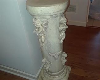 Pedestal with applied cherubs on column