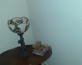 Tiffany style lamp with cherub base and stained glass shade