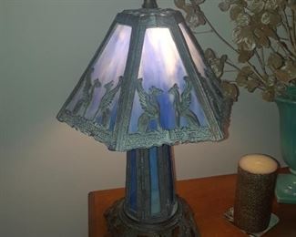 Slag glass lamp, circa 1920, griffin figures in frame
