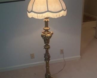 Ornate floor lamp with fringed shade