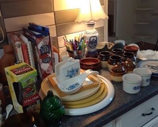 Kitchen wares including spice carousels, cookbooks, soup and condimint bowls, napkin holders, lamp, and more