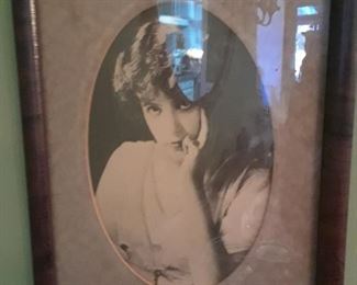 One of a pair of framed photo portraits