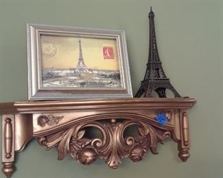 Wall shelf with Eiffel Tower collectibles
