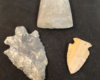 Two arrowheads and a hand axe
