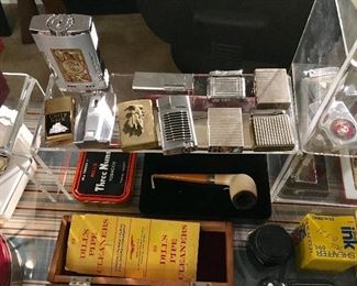 TABLE LIGHTERS, ST DUPONT, ZIPPOS, MILITARY LIGHTERS AND MORE.