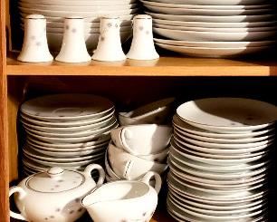 Large set of silver rimmed dishes has many serving pieces as well as many five piece place settings
