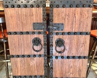 Wood and iron doors with pulls and latch