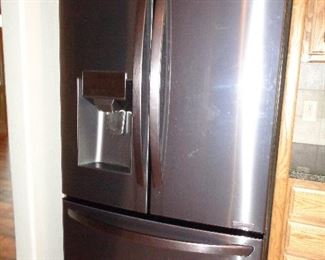 less than one year old stainless steel fridge