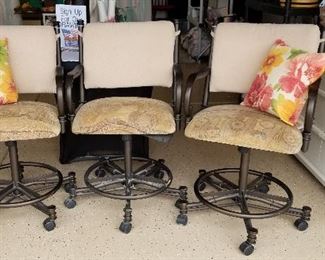 3 swivel bar stools with great cushioned backs.
