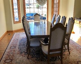 Large Pecan dining table wit 2 leafs and 8 upholster chairs. Beautiful 9 x 12 wool rug