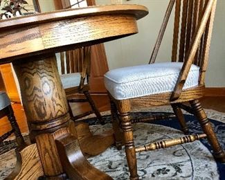 Round oak table, side view of chairs...very nice!