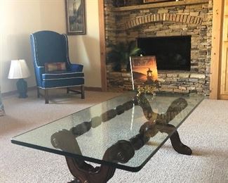 Glass top coffee table, blue wing back chair (Ethan Allen)