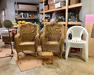 Two wicker chairs and 4 plastic chairs