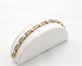 10k yellow gold diamond bracelet with total diamond weight of 2.50Ct.  "the diamonds are knife set"