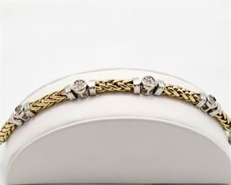 14k yellow & white gold diamond bracelet with total weight of round brilliant cut diamonds of 1.00 Ct. 