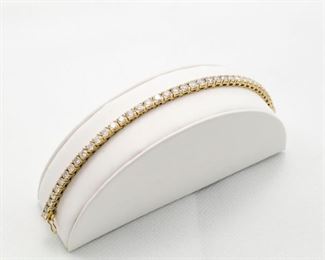 14k yellow gold diamond tennis bracelet, 40 round brilliant cut diamonds with total diamonds weight of 10.00 Ct. 
