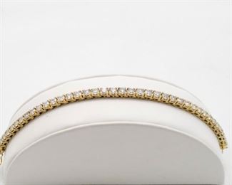 14k yellow gold diamond tennis bracelet, 40 round brilliant cut diamonds with total diamonds weight of 10.00 Ct. 