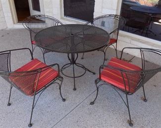 wrought iron patio table with chairs
