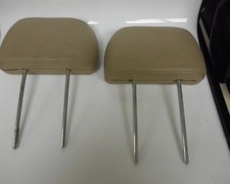 2 Tan Leather automobile head rests