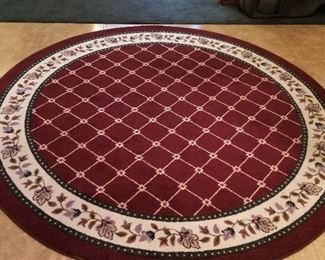 Large round rug looks like new. Beautiful coloring of deep reds.