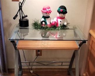 This is a great glass desk. Usually they are huge. This is a perfect size for anywhere you need. It has a pull out keyboard. So perfect!