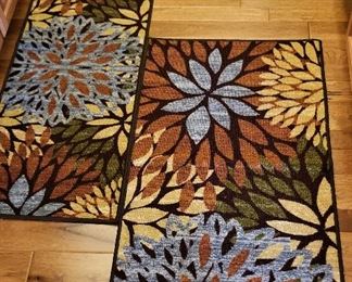 Pretty rugs of blue and rust coloring