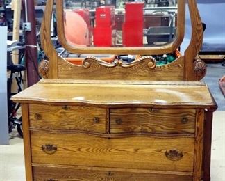 Antique 4-Drawer Dresser With Tilting Beveled Mirror, Partial Serpentine Front, Brass Pulls, Dovetail Construction, On Wheels, 72" H x 45" W x 23" D