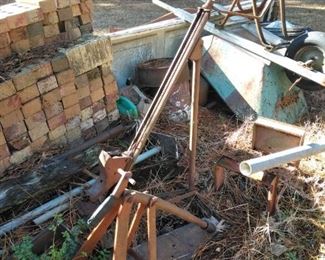 Scrap iron and wheel barrow in the back yard