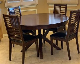 Contemporary Dark Wood Dining Table w/ 4 Chairs	Table: 30.5in H x 51 in Diameter.   Chairs: 39x18x19in seat height : 19.5in H	HxWxD
