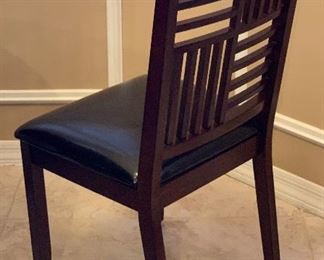 Contemporary Dark Wood Dining Table w/ 4 Chairs	Table: 30.5in H x 51 in Diameter.   Chairs: 39x18x19in seat height : 19.5in H	HxWxD
