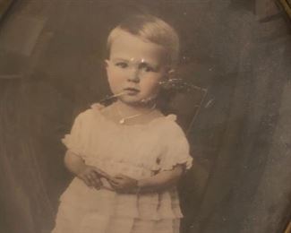 late 1800's sepiatone photograph in gold gilted oval frame.