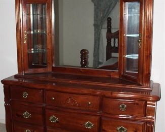 Pine 1980’s 9-Drawer Dresser w/ Mirror and Framed on each side by 3-Shelf Curio (68”W x 19 1/2”D x 84”H)