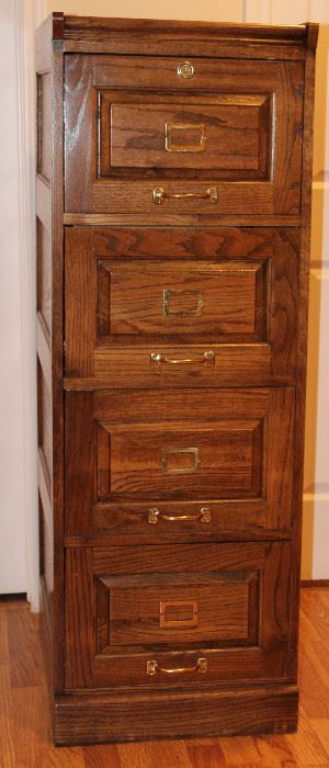 Oak Legal Size 4-Drawer Vertical Filing Cabinet. 1 of 2 Shown. (18 3/4”W x 25”D x 53 1/2”H)