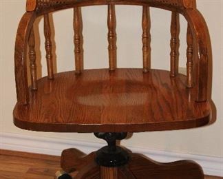 Windsor Style Oak Cane/Spindle Back Swivel Deak Chair