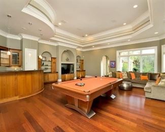 Family room with access doors to pool