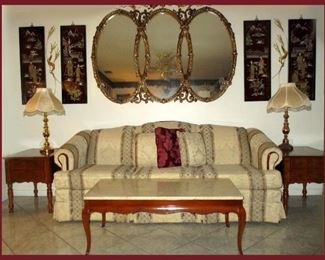Family Room with Large Ornate Mirror, Matching End Tables, Matching Lamps, Marble Top Coffee Table and Asian Inspired Wall Plaques