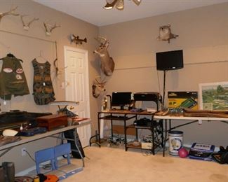 room full of hunting and fishing and man stuff (and woman stuff too)