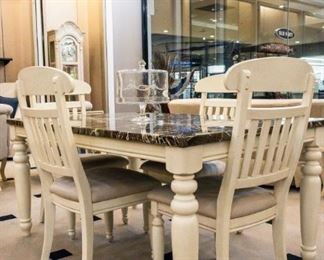 This dining room set is absolutely one of my favorites - perfect even for families! All vinyl seats and a tabletop that is easy to clean. LOVE!