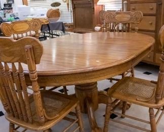 Oak Table/Five Chairs, and table protection covers.