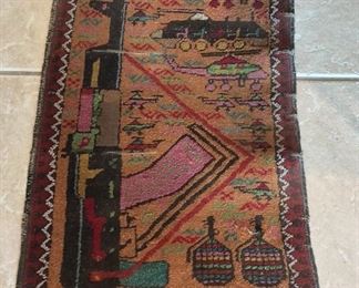Pakistan Rug depicting Afghanistan under Soviet rule, 20" x 36".
