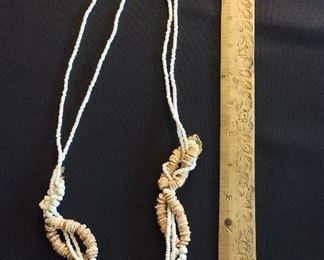 Long Strands of Ostrich Shell Beads of various sizes.
