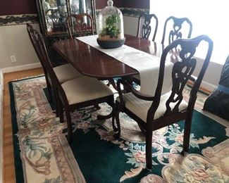 Pennsylvania House Table with 6 chairs. 2 extra leaves. Rug measures 8’ x 11’.