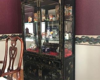 Asian China / Display cabinet. Measures 39 1/4 inches across 67 and three-quarter inches tall and 16 1/2 inches deep.