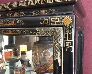 Asian China / Display cabinet. Measures 39 1/4 inches across 67 and three-quarter inches tall and 16 1/2 inches deep.