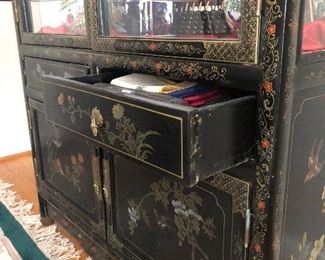 Asian China / Display cabinet. Measures 39 1/4 inches across 67 and three-quarter inches tall and 16 1/2 inches deep.