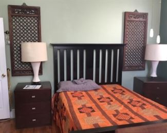 Queen size bed with good Sealy mattress, pair of oriental carved plaques. 