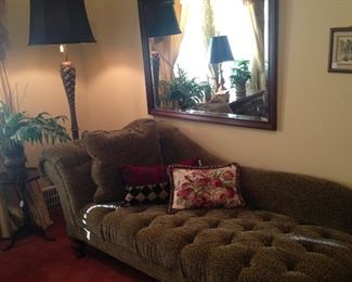 Welcoming chaise; floor lamp; one of several mirrors