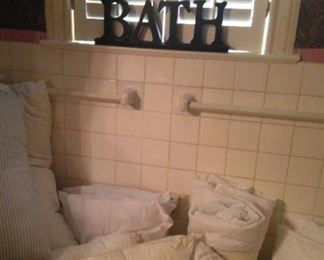 A bathtub full of pillows