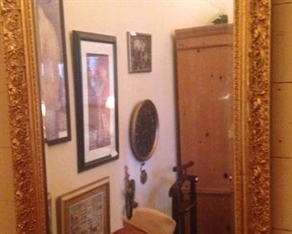 A gold framed mirror