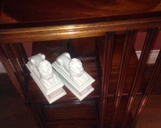 Lion bookends; revolving & rolling bookcase .  .  . 
